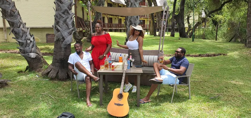 Friends relaxing at a riverside lodge